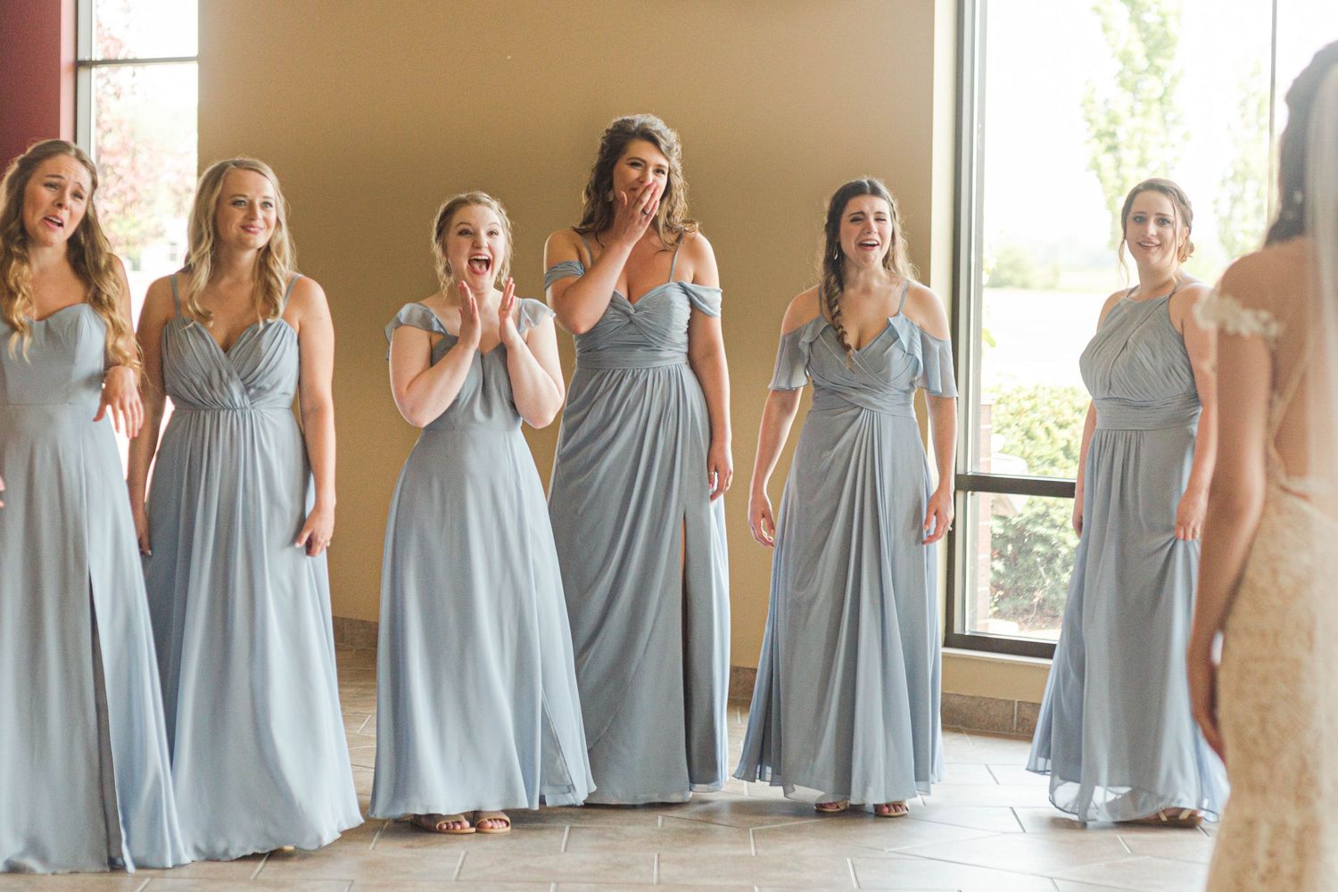 Bride with bridesmaids first look
