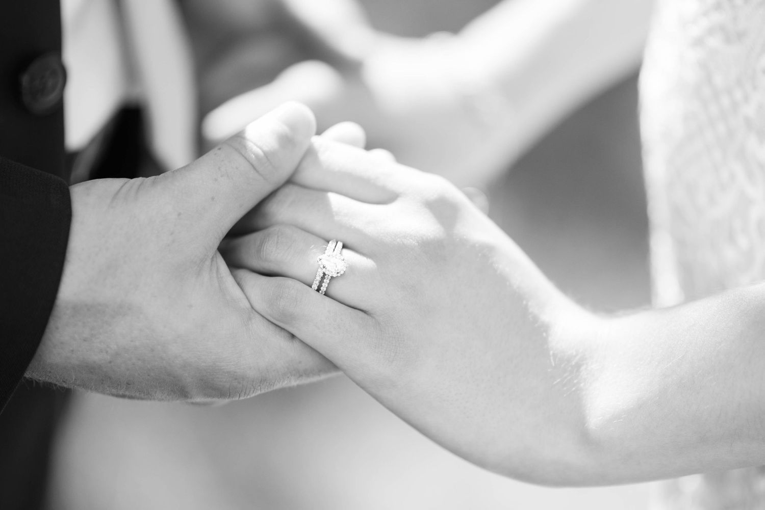 Intimate hand holding wedding ring