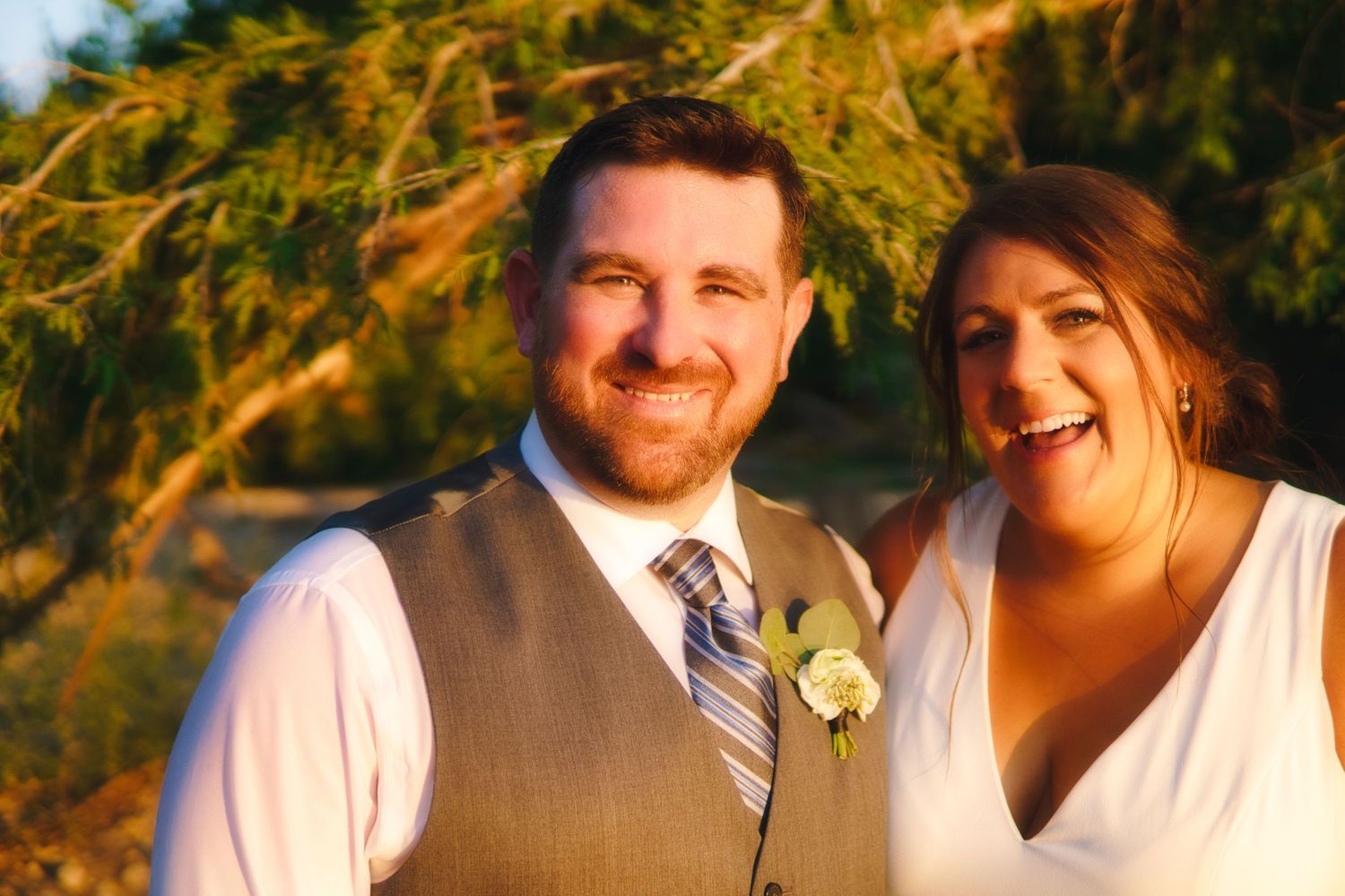 newlyweds smile at the camera