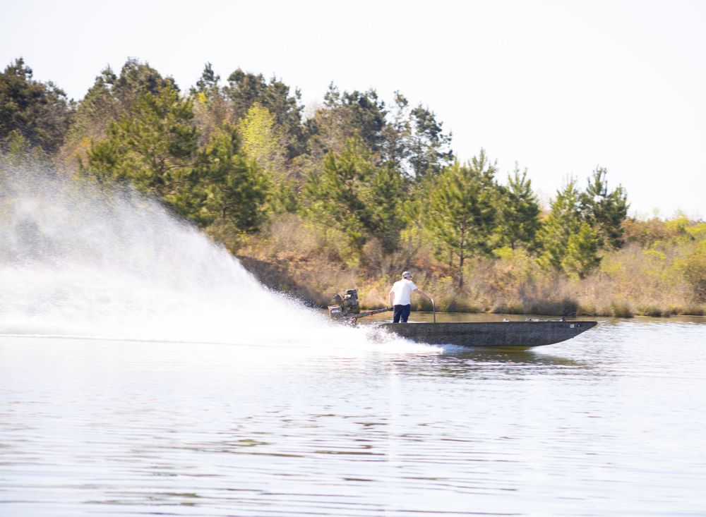 senior boy driving boat