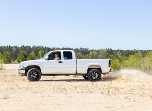 senior boy driving white truck