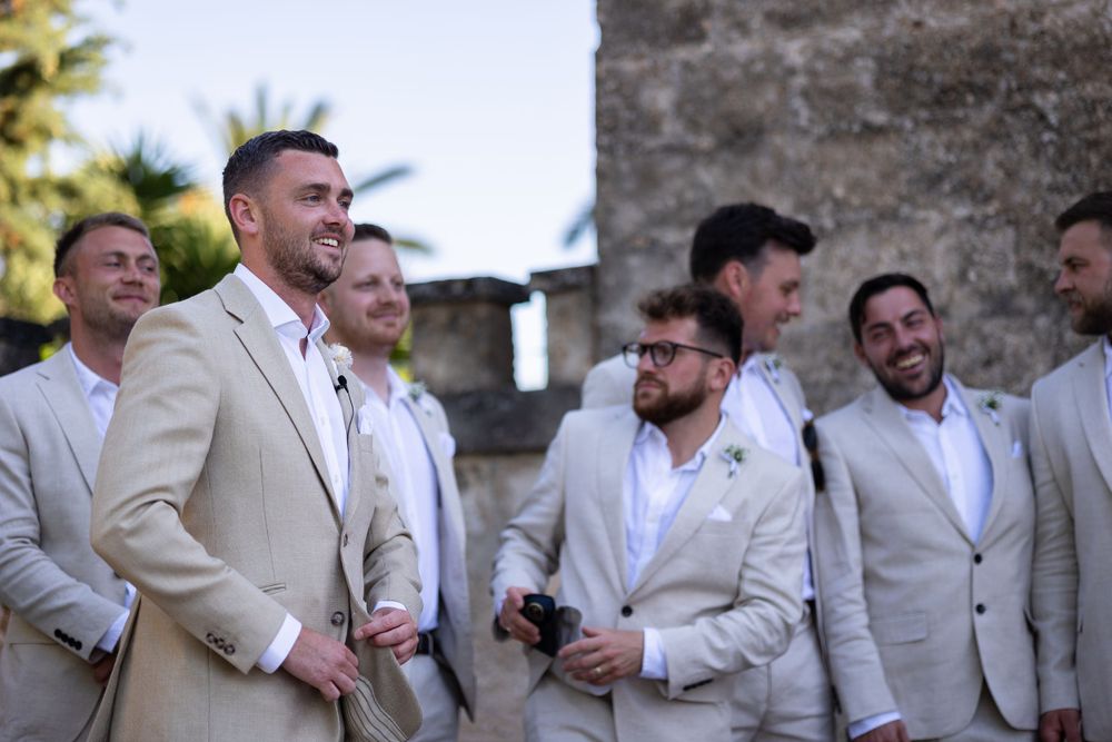 Groom and groomsmen waiting for the bride at the alter