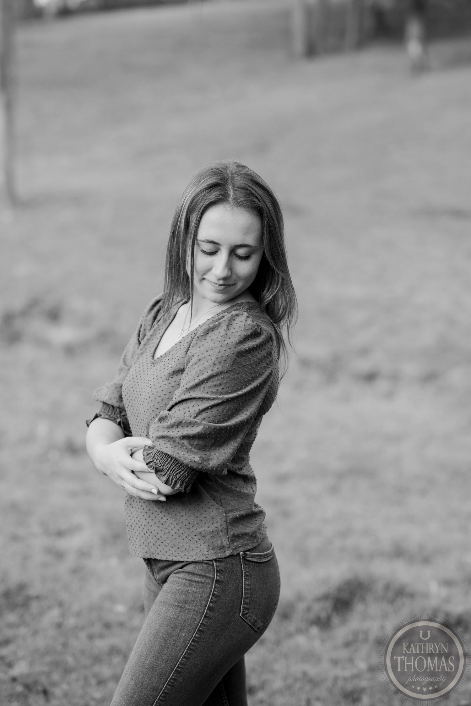 Black and white casual portrait in outdoor setting with soft natural light.