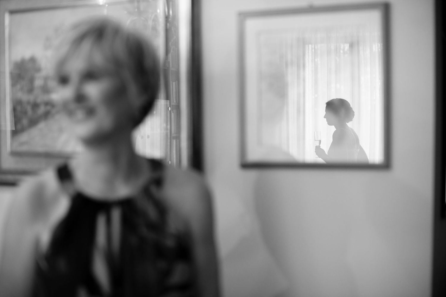 Artistic black and white composition with mirror reflections and silhouettes.