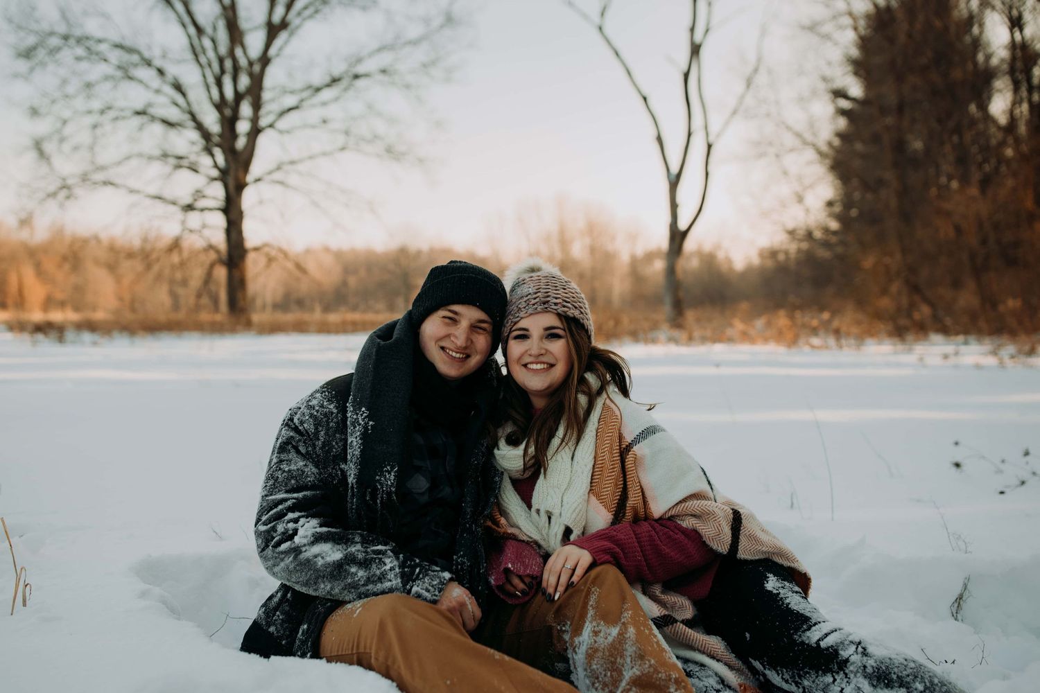Couple-smiling-in-snow