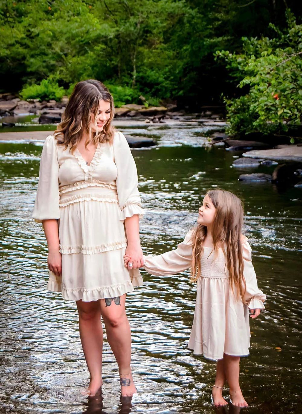 White dress photoshoot with mom and daughter wading in a scenic creek.