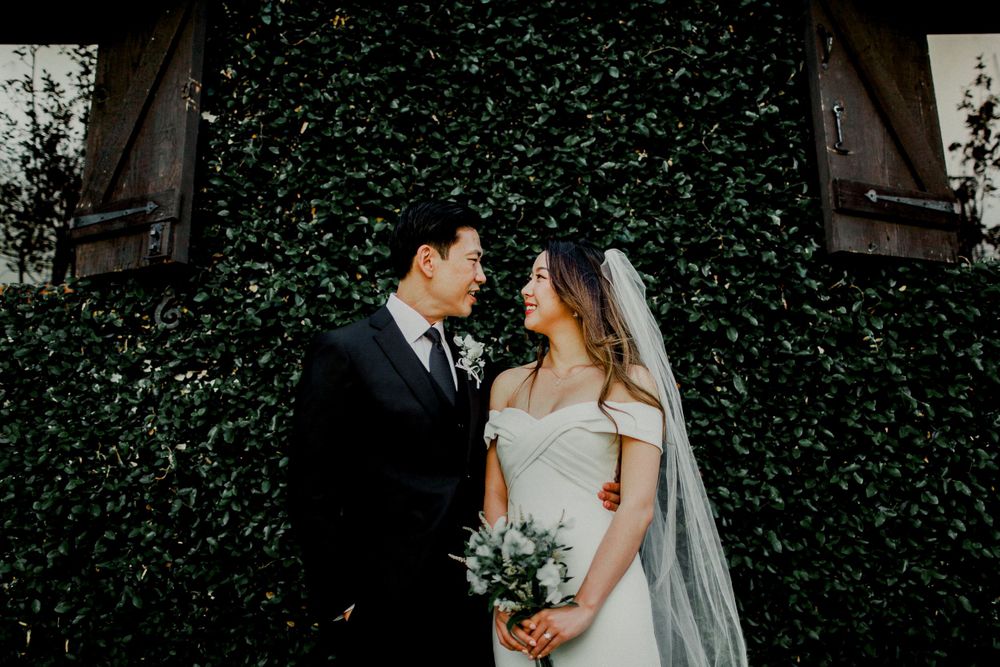 groom staring into bride's eyes