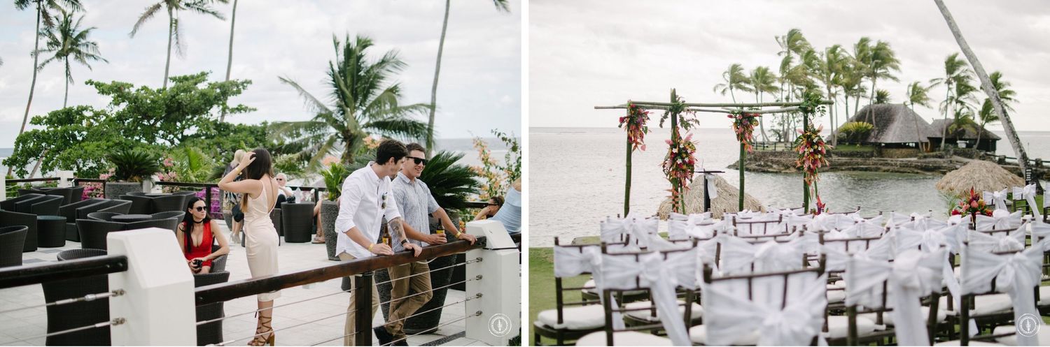Wedding bar setup and white ceremony chairs arranged at an oceanfront tropical venue.