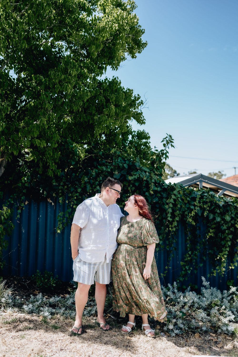 A husband and wife in their front yard in Perth