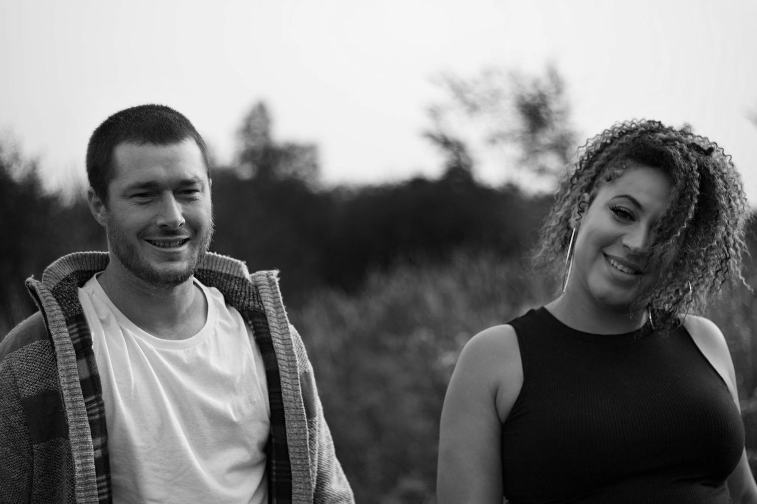 A series of black and white candid portraits showing laughter and joy.