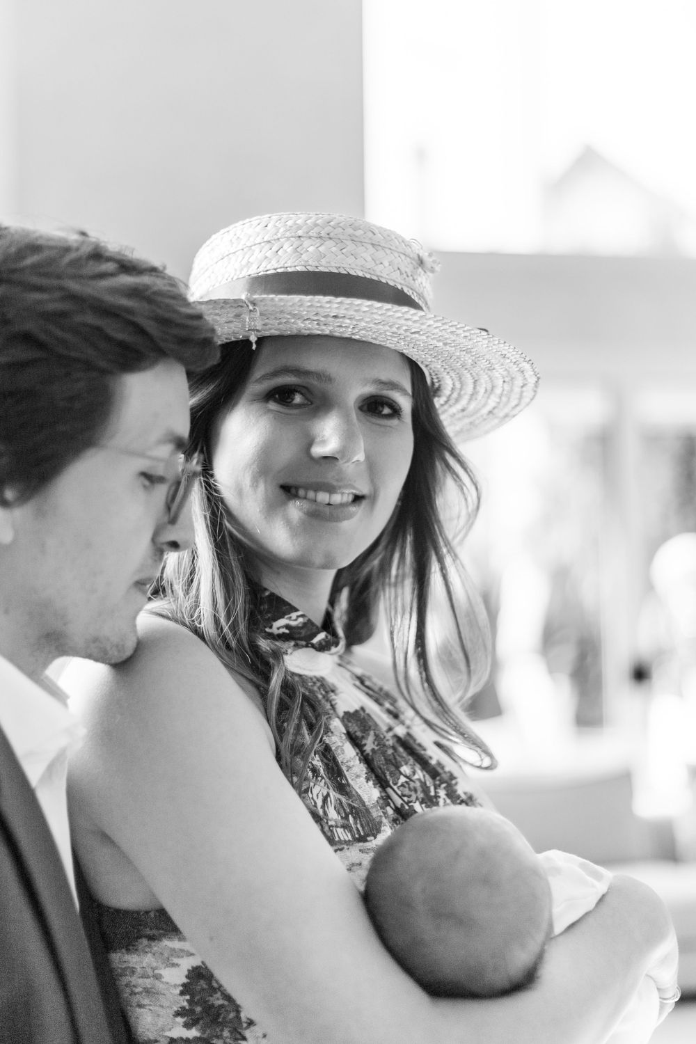 An intimate black and white moment during a baby celebration.