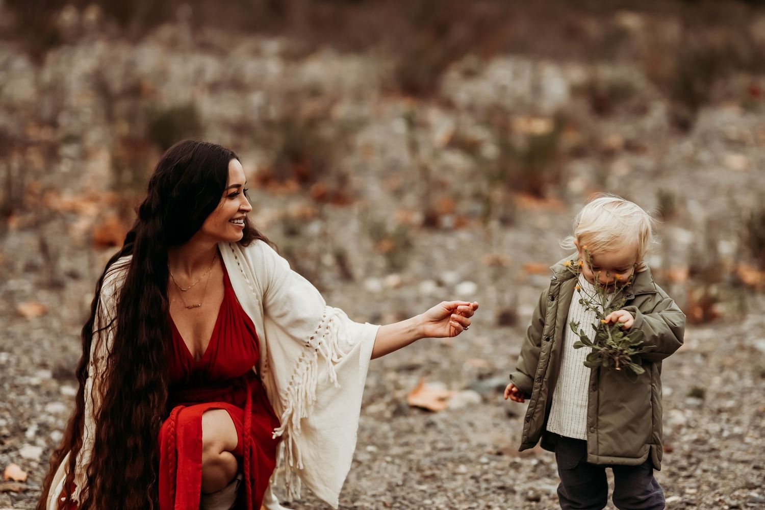 Mother plays with her son during the California fall season