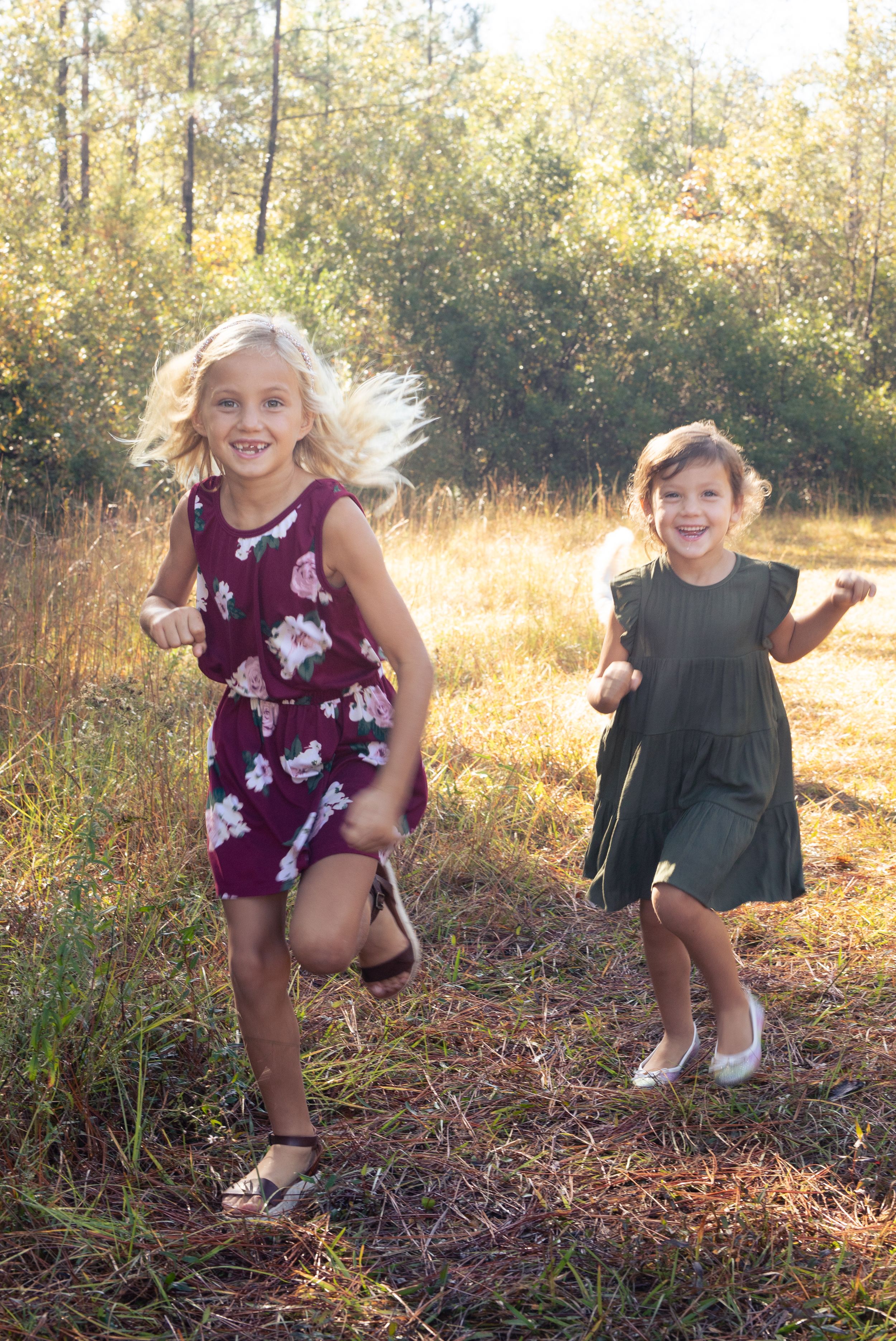 Outdoor Portrait of Sisters Running in Field