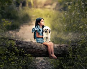 Outdoor Portrait of Little Girl on Fallen Log with Little Dog