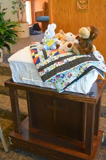 Image of Amos' casket with his stuffed animals on it during his funeral at Morningside Baptist Church in Sioux City, IA.