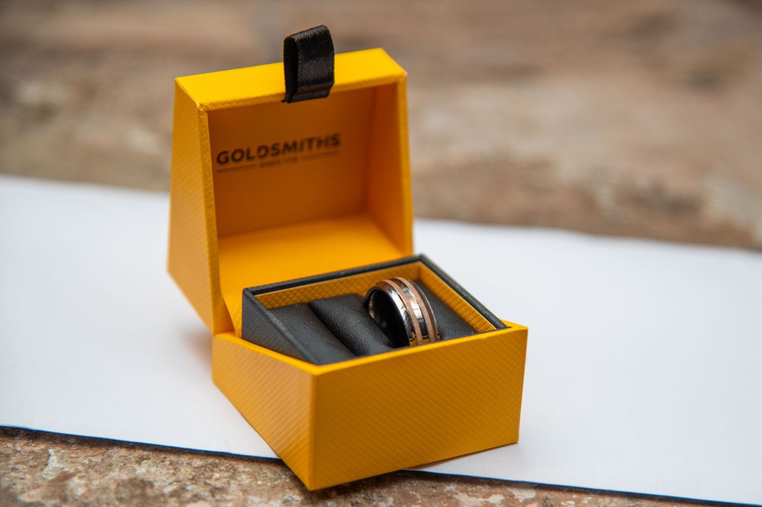 Yellow gift box opening sequence revealing contents inside.