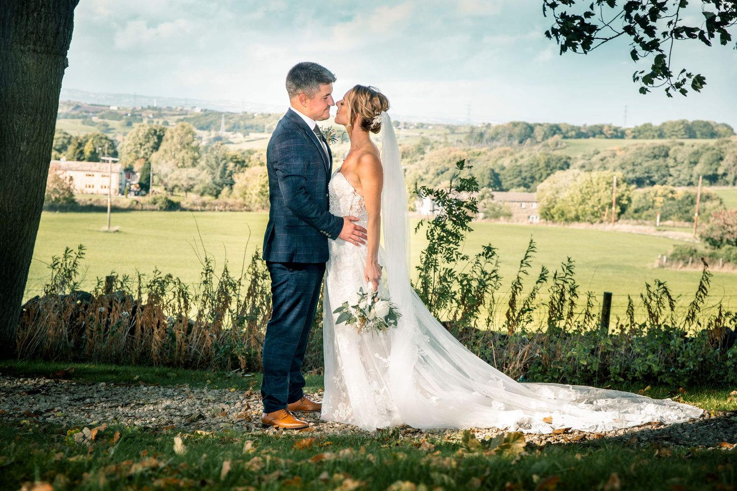 bride and groom wedding photograph at 315 restaurant with yorkshire landscape behind