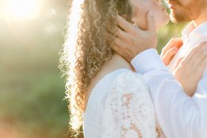 Romantic golden hour moment with sunlight filtering through.