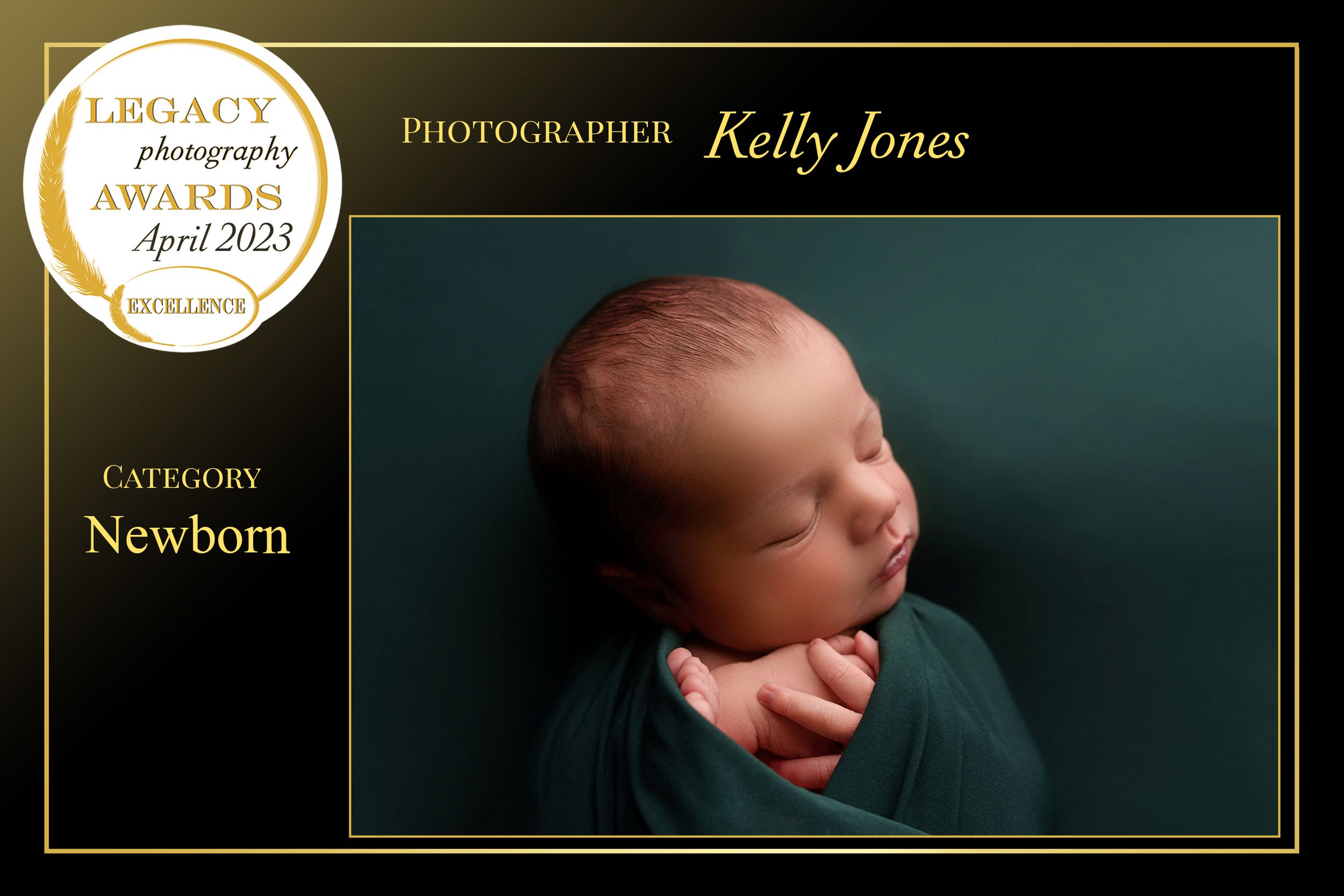 Dreaming newborn wrapped in dark teal fabric in elegant award-winning photograph.