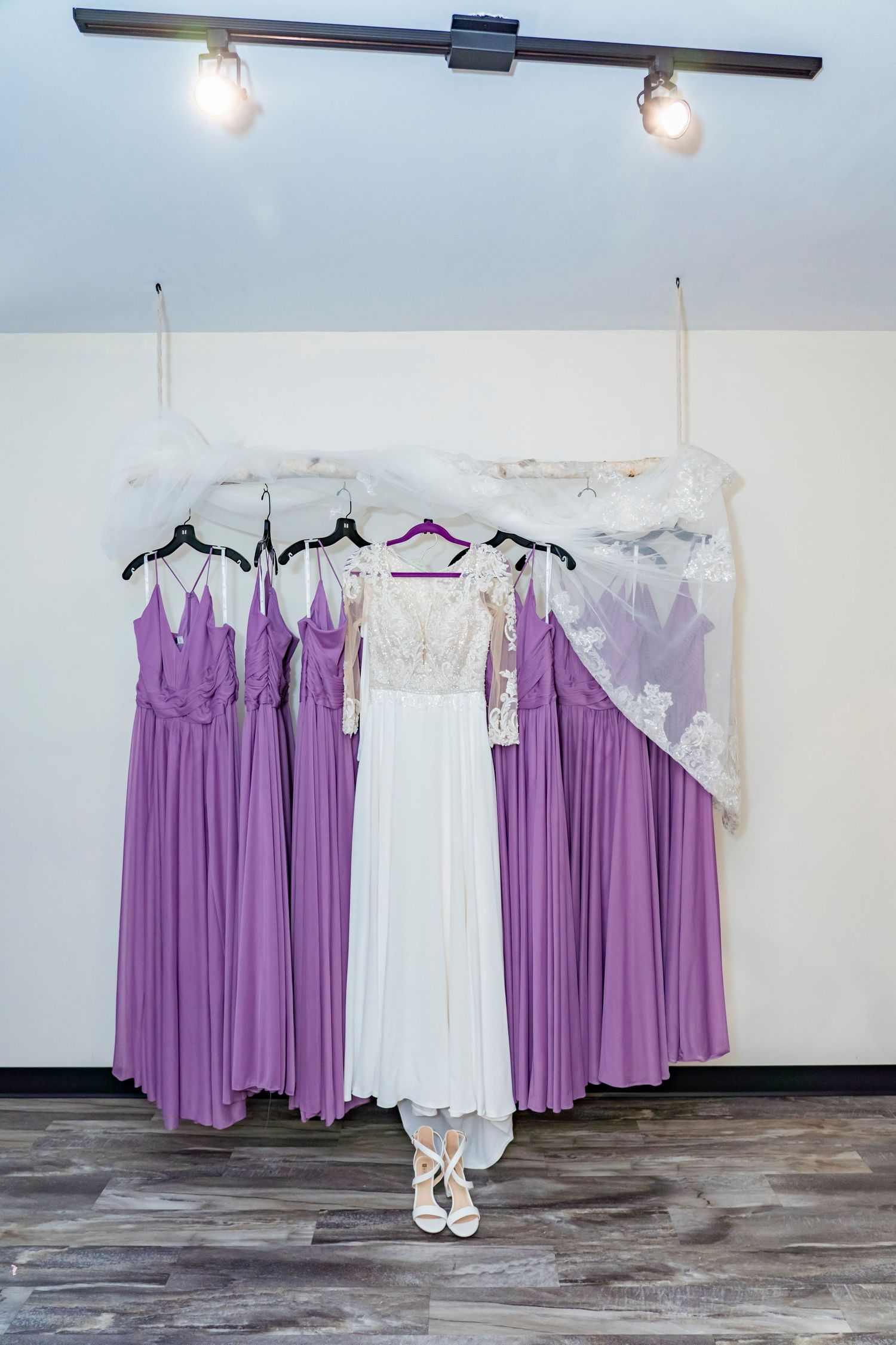 Bridesmaids dress and wedding dress hanging - Kalamazoo Wedding Venue - Photographer and Videographer Almost Fantasy