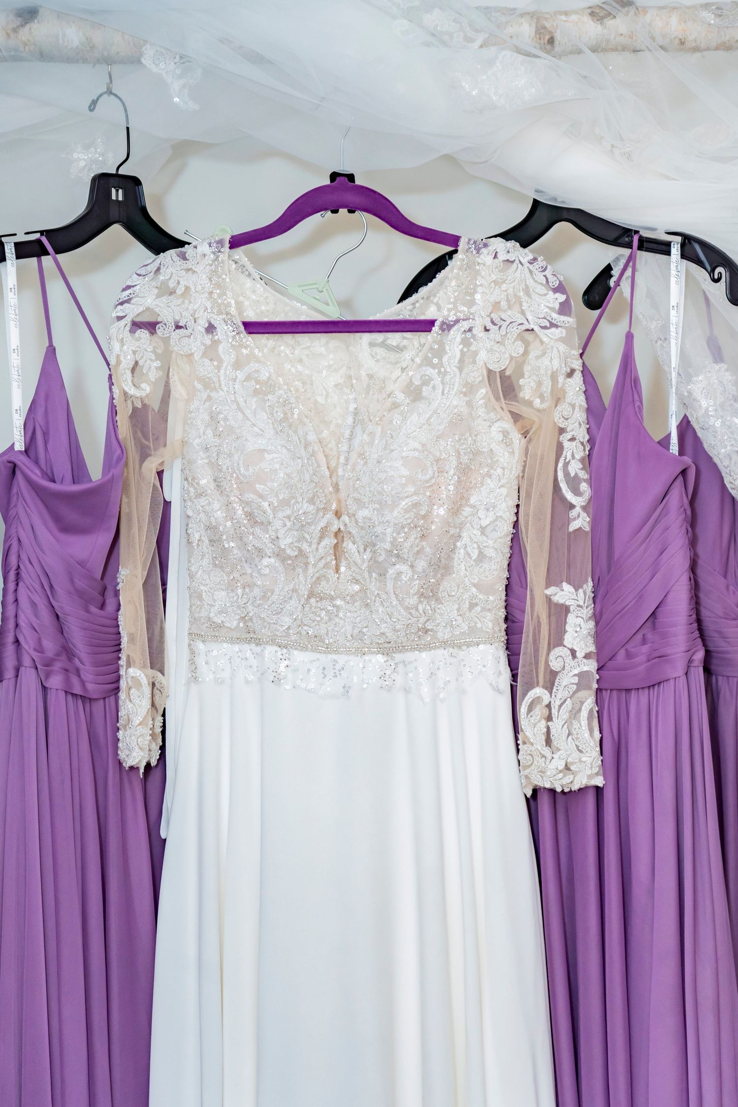 Bridesmaids dress and wedding dress hanging - Kalamazoo Wedding Venue - Photographer and Videographer Almost Fantasy