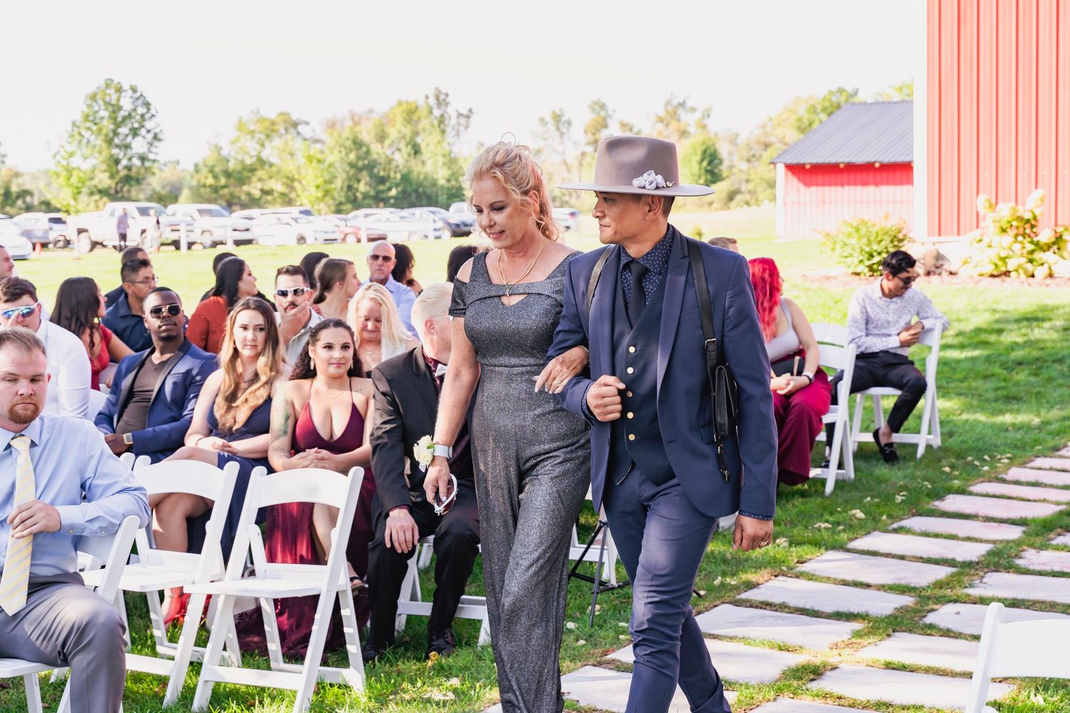 Usher escorting mom to her seat for the ceremony - Blue Heron Barn