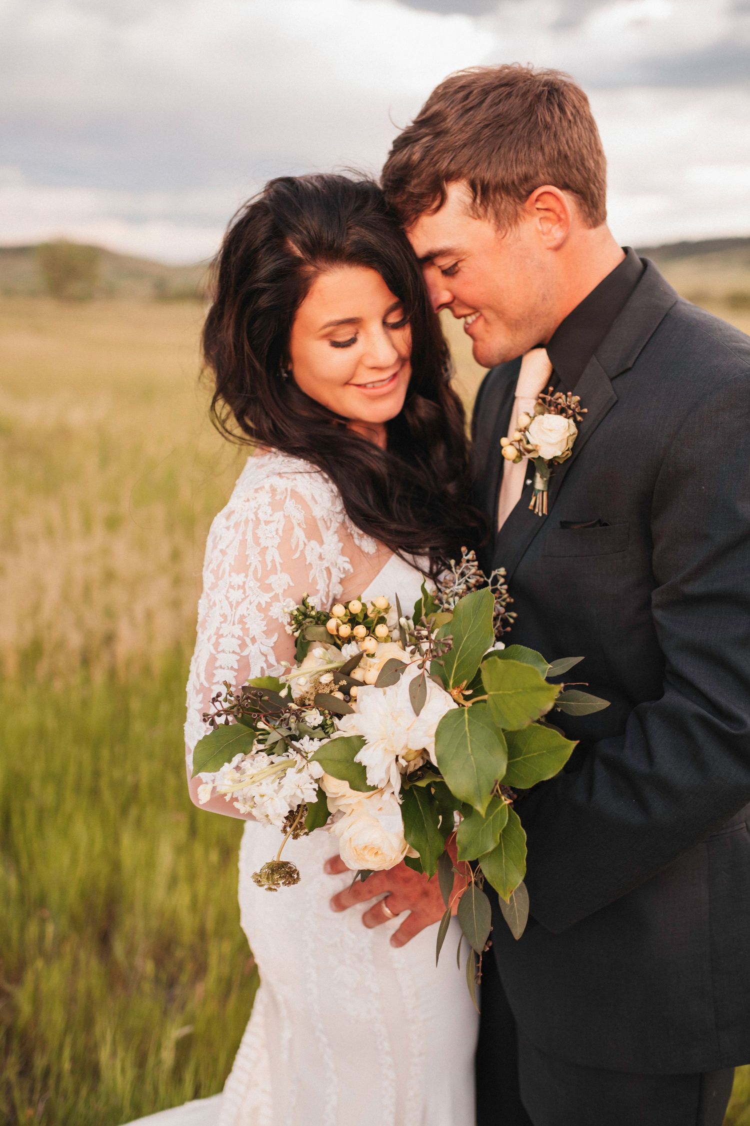 Happy couple smiling in a field