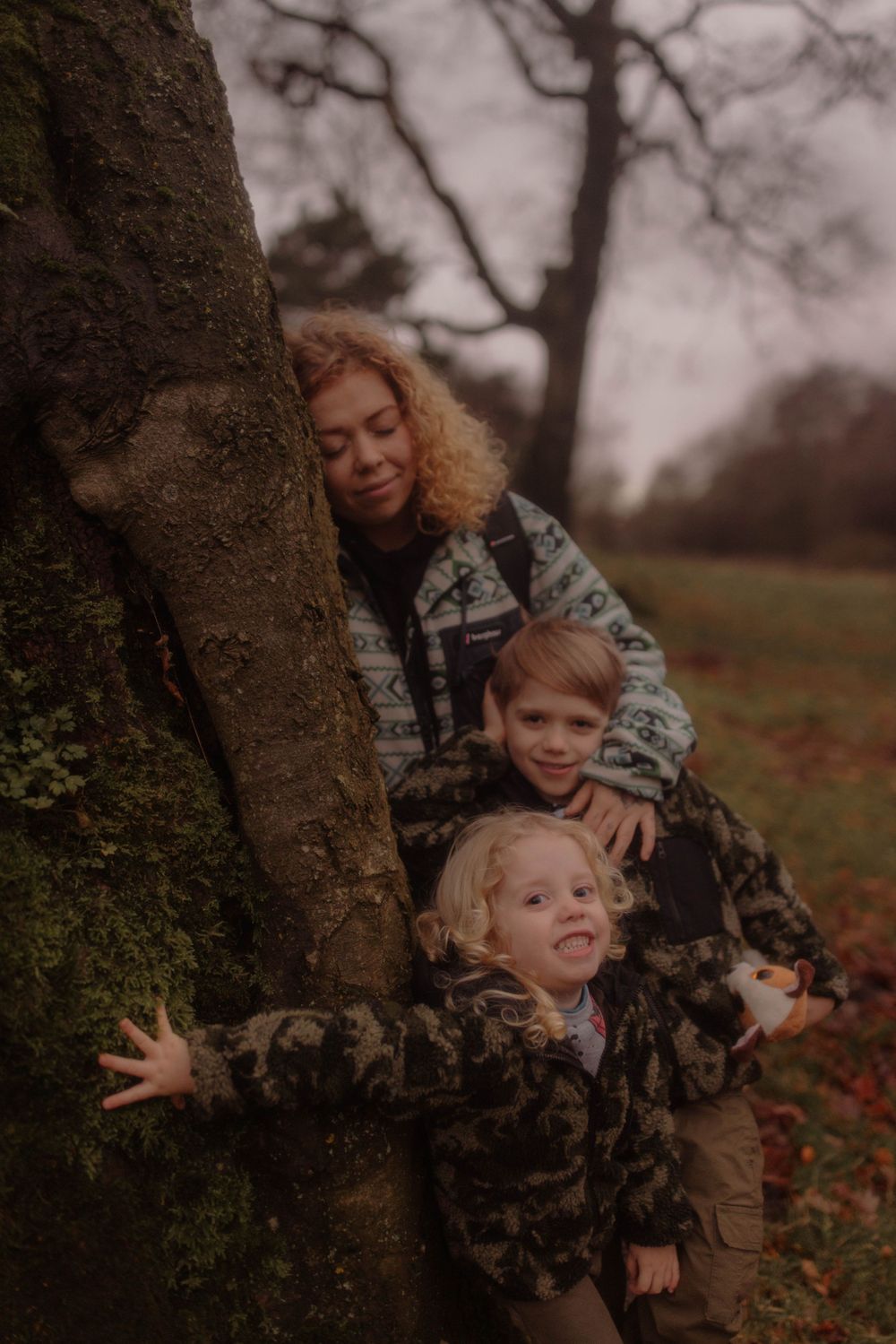 mum and three children in the woods