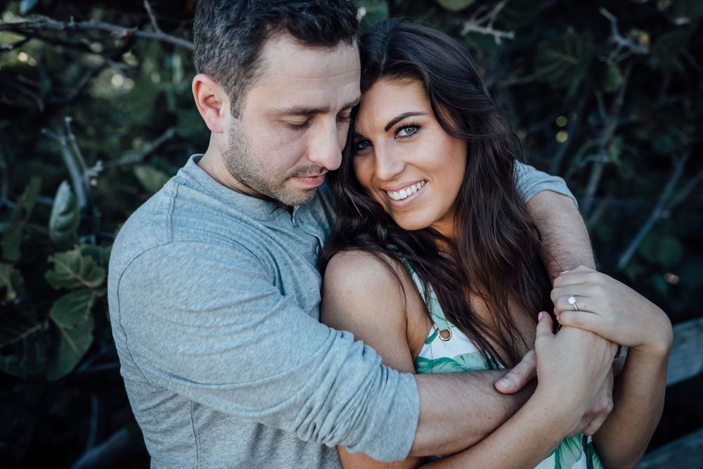 couple embracing during engagement session at Miami beach Florida
