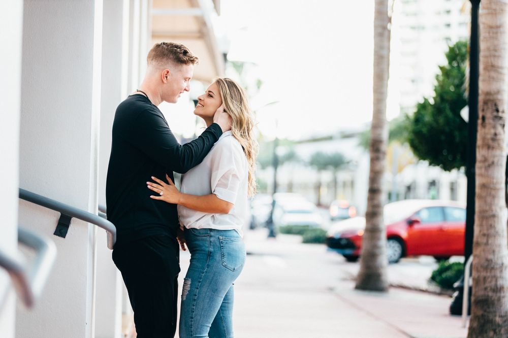 couple looking at each other during an engagement session in Miami Beach near Prime Italian restaurant