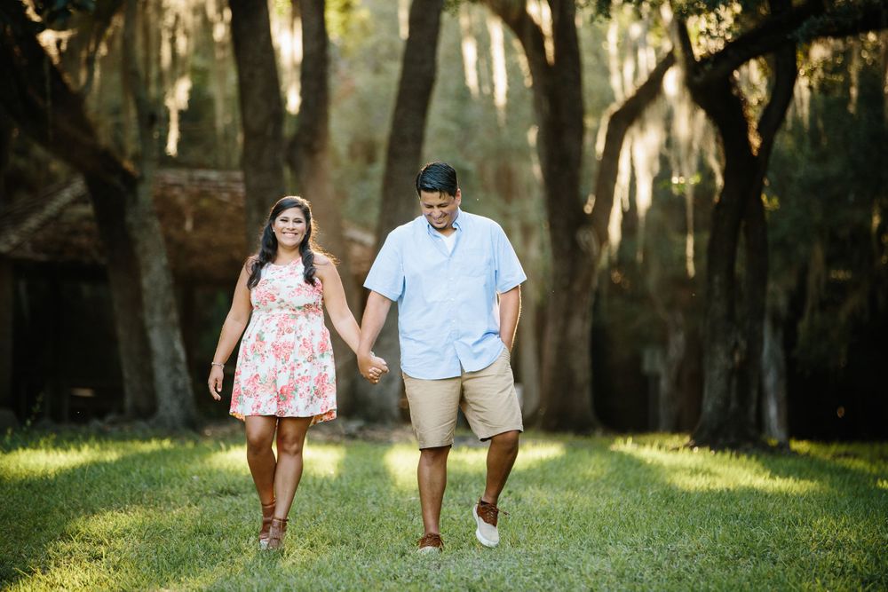 couple holding hands while walking at Matheson hammock park in Miami Florida