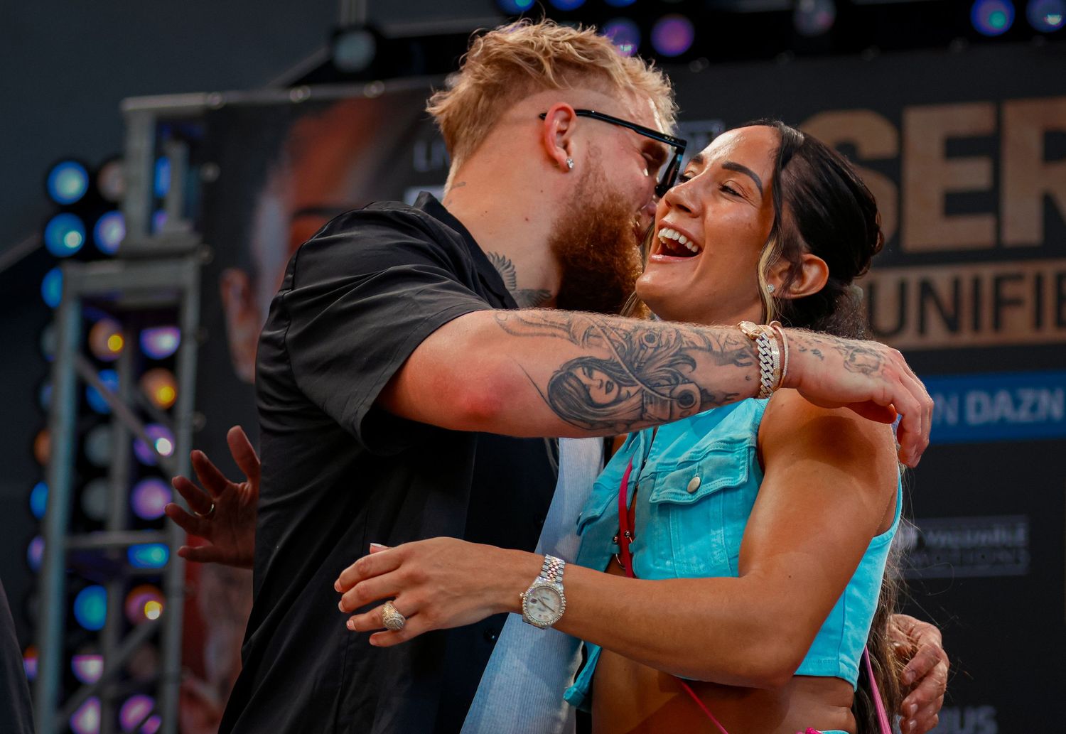Amanda Serrano and Jake Paul meet at the press conference and hug each other.