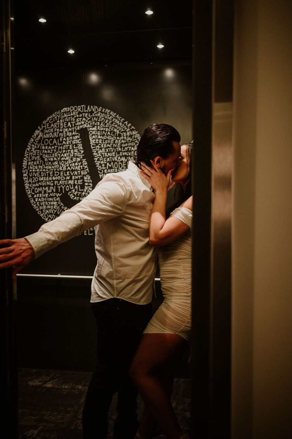 Artistic black and white photo sequence showing intimate moments against a dark wall with text.