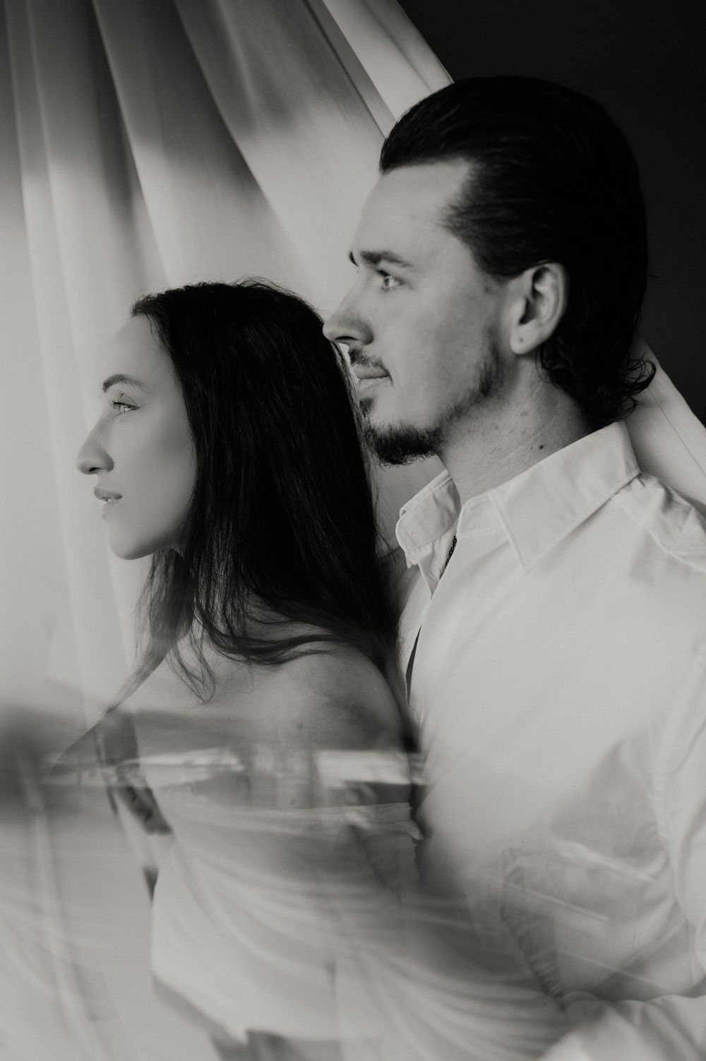 Artistic motion blur portrait in black and white with soft lighting.