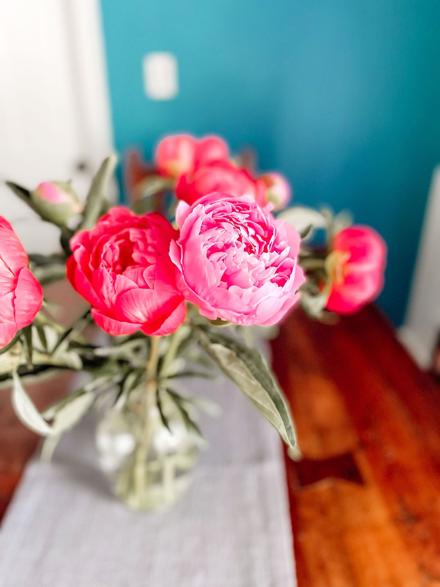 Peonies on the table, beautiful pink peonies, hot pink flowers