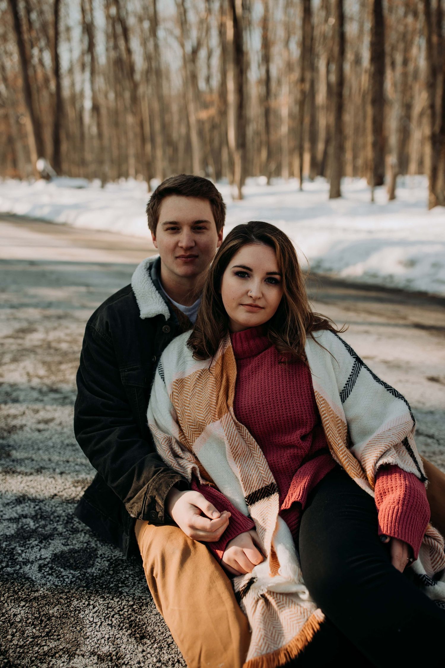 couple-sitting-on-road-engagement-session