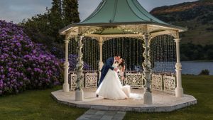 bride and groom dip at Inn on the Lake
