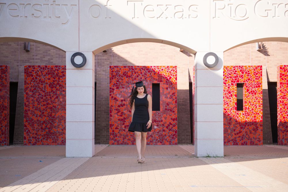 girl walking under the arches. UTRGV session. Edinburg, Texas. wedding photography