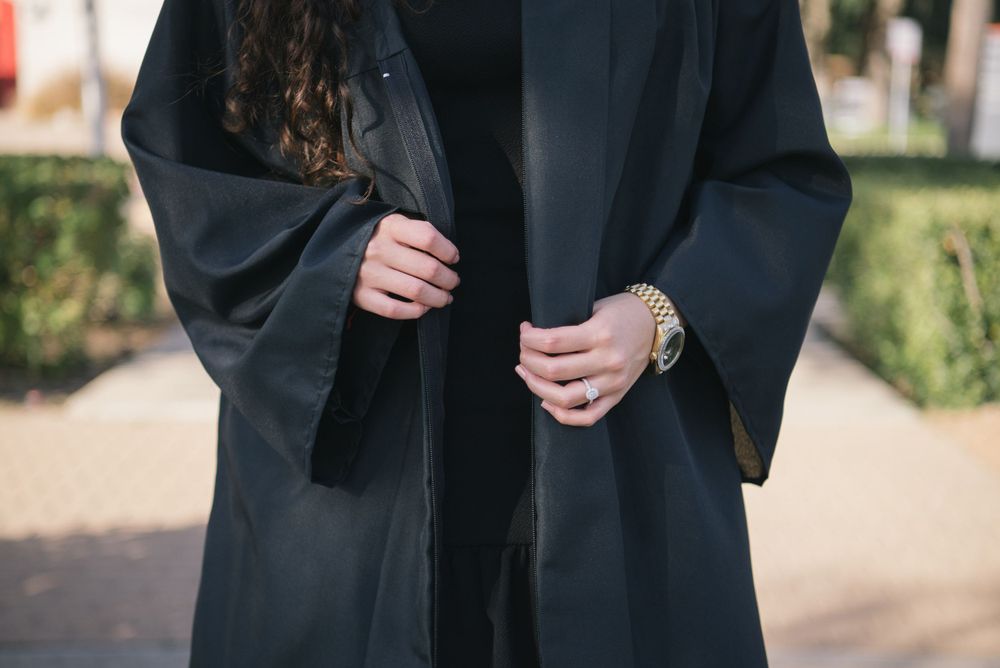details of a graduated girl hands. UTRGV session. Edinburg, Texas. wedding photography