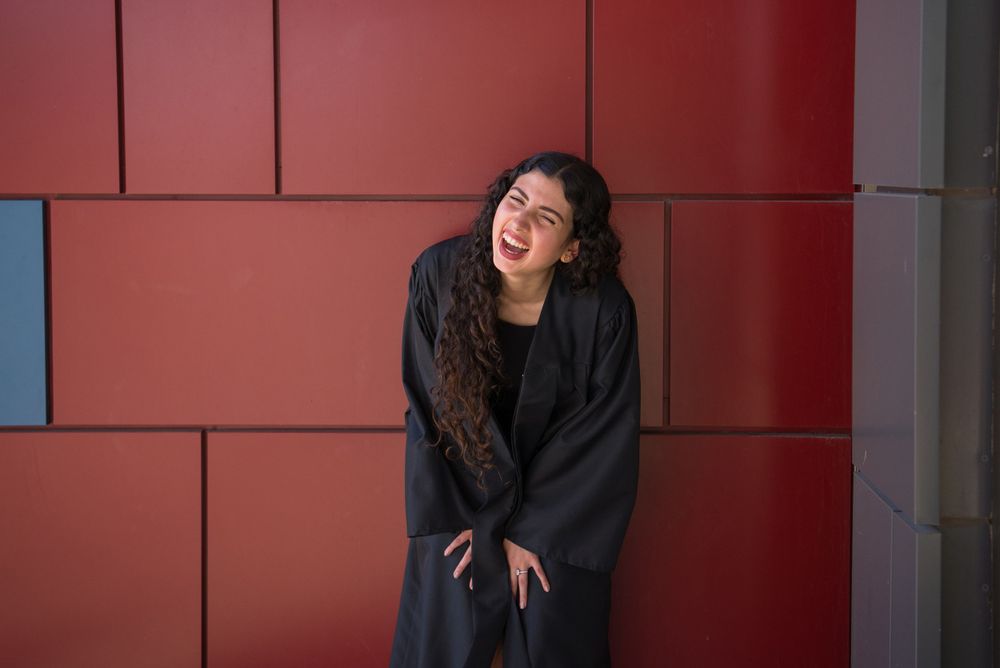 girl laughing at her photo shoot. UTRGV session. Edinburg, Texas. wedding photography