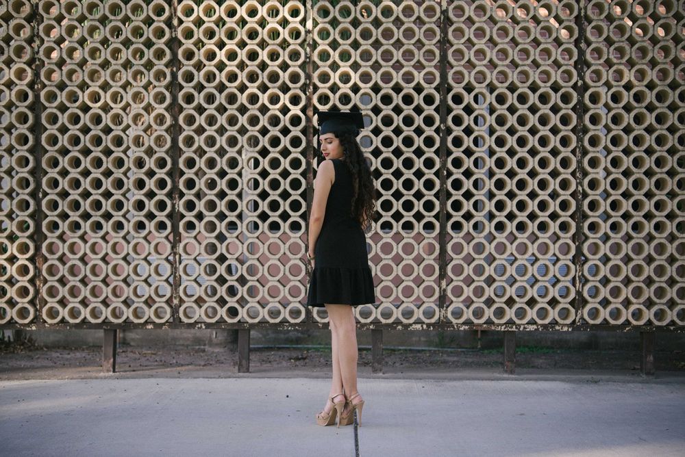 graduated girl in short dress posing. UTRGV session. Edinburg, Texas. wedding photography