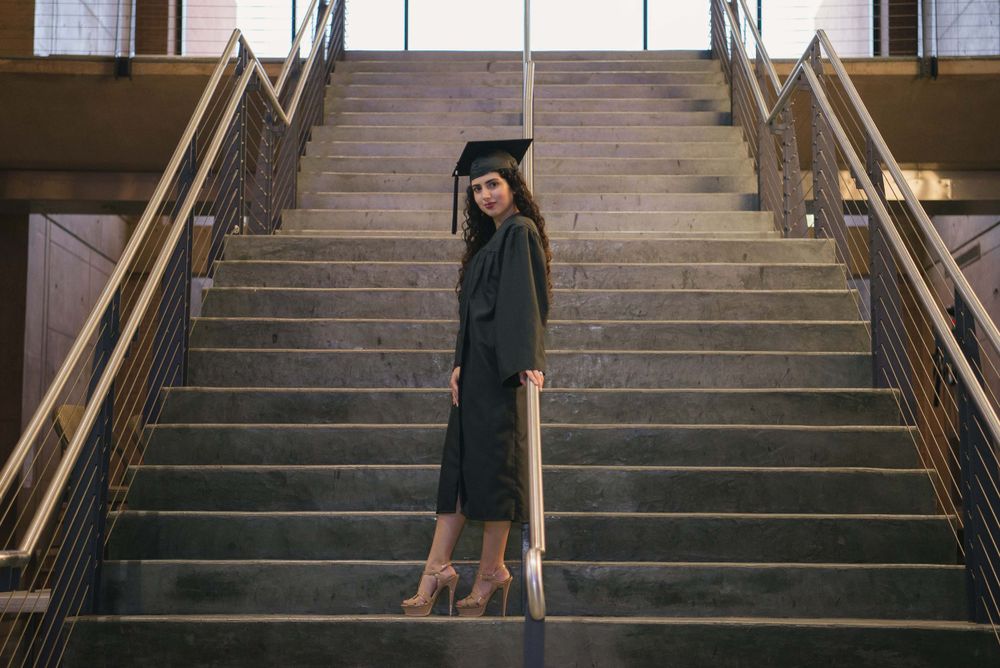 graduated girl at the stairs. UTRGV session. Edinburg, Texas. wedding photography