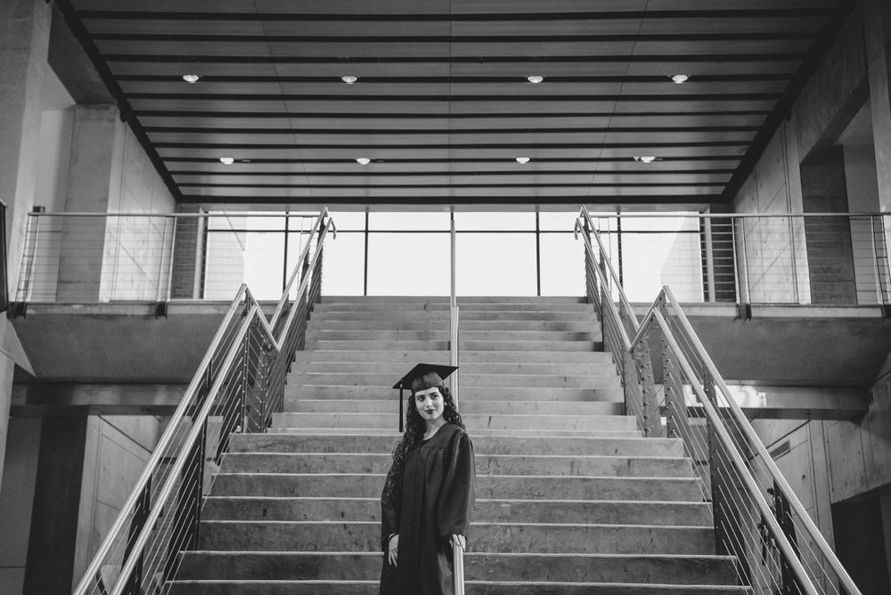 graduated in front fo big stairs. UTRGV session. Edinburg, Texas. wedding photography