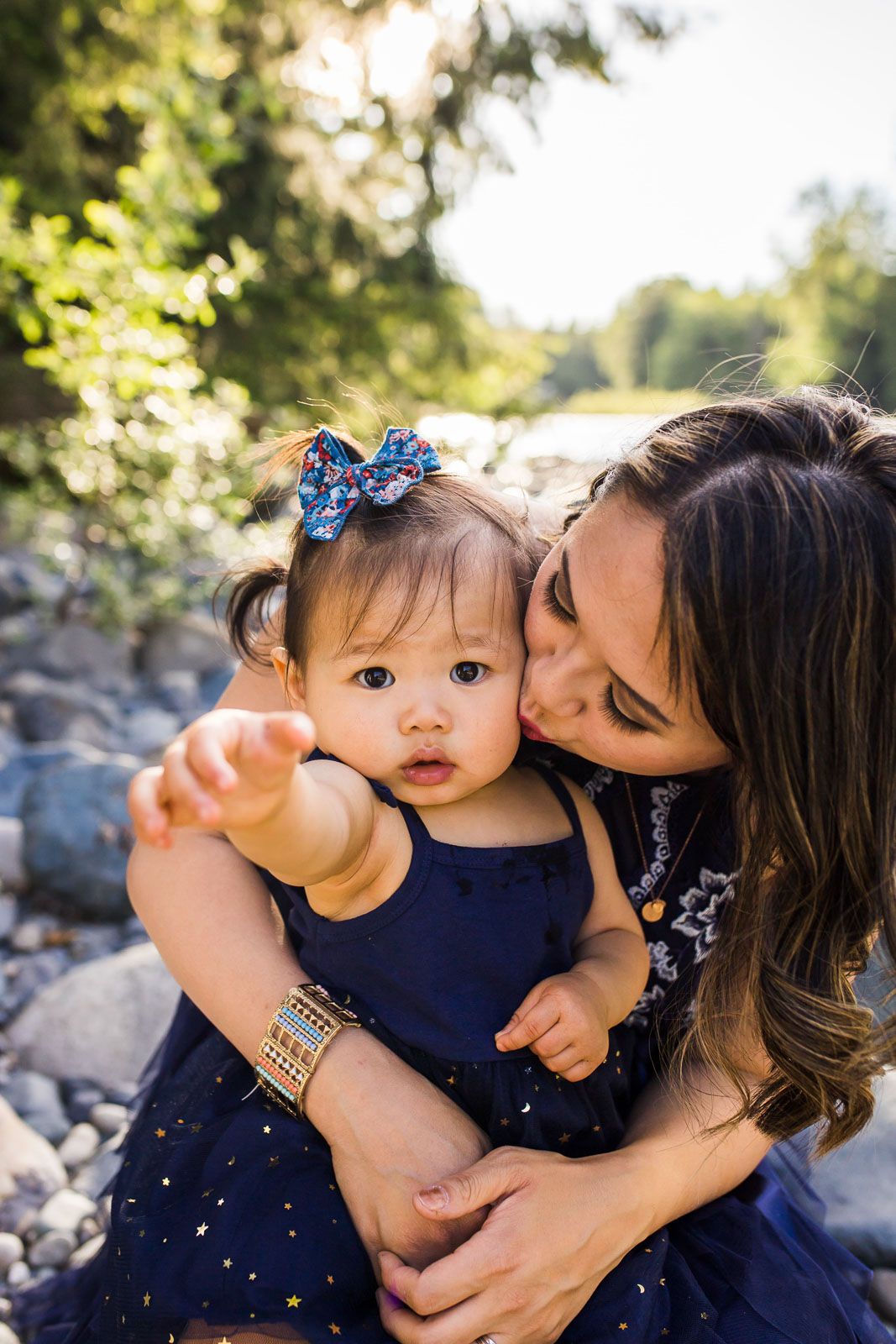 Mother kissing daughter at Tanner Landing