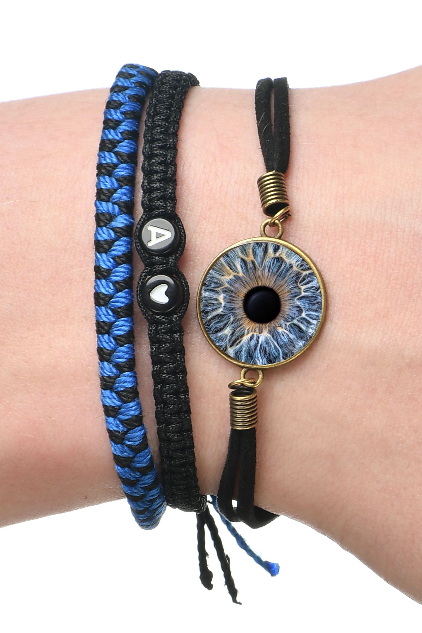 Braided bracelet set featuring blue cord and eye design pendant.