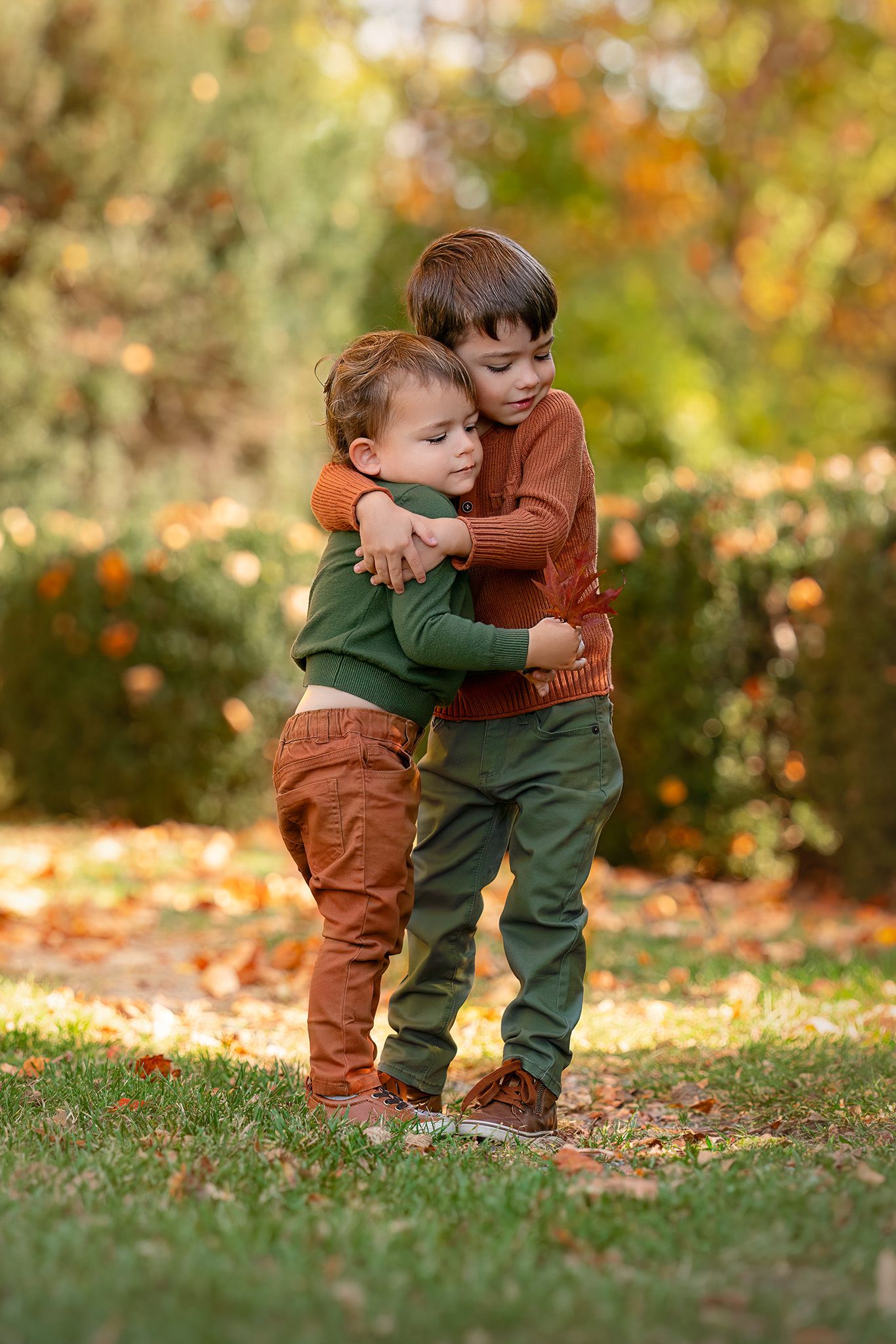 boys snuggle in sibling portrait