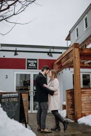 Romantic winter scene outside Tooth and Nail brewery with snow on the ground.