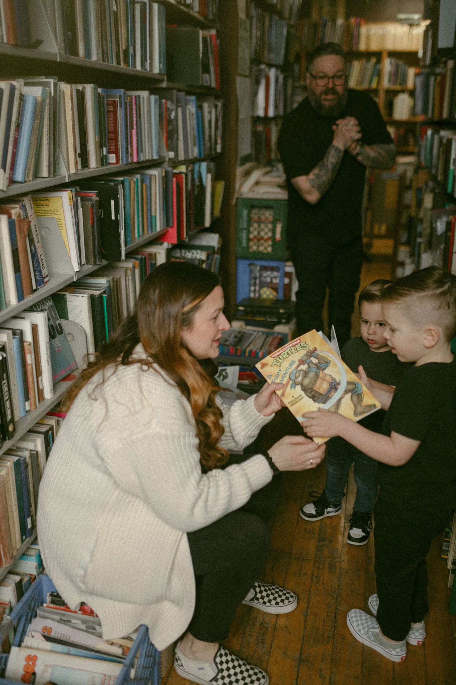 untraditional, unique family photos taken in a bookstore in downtown detroit