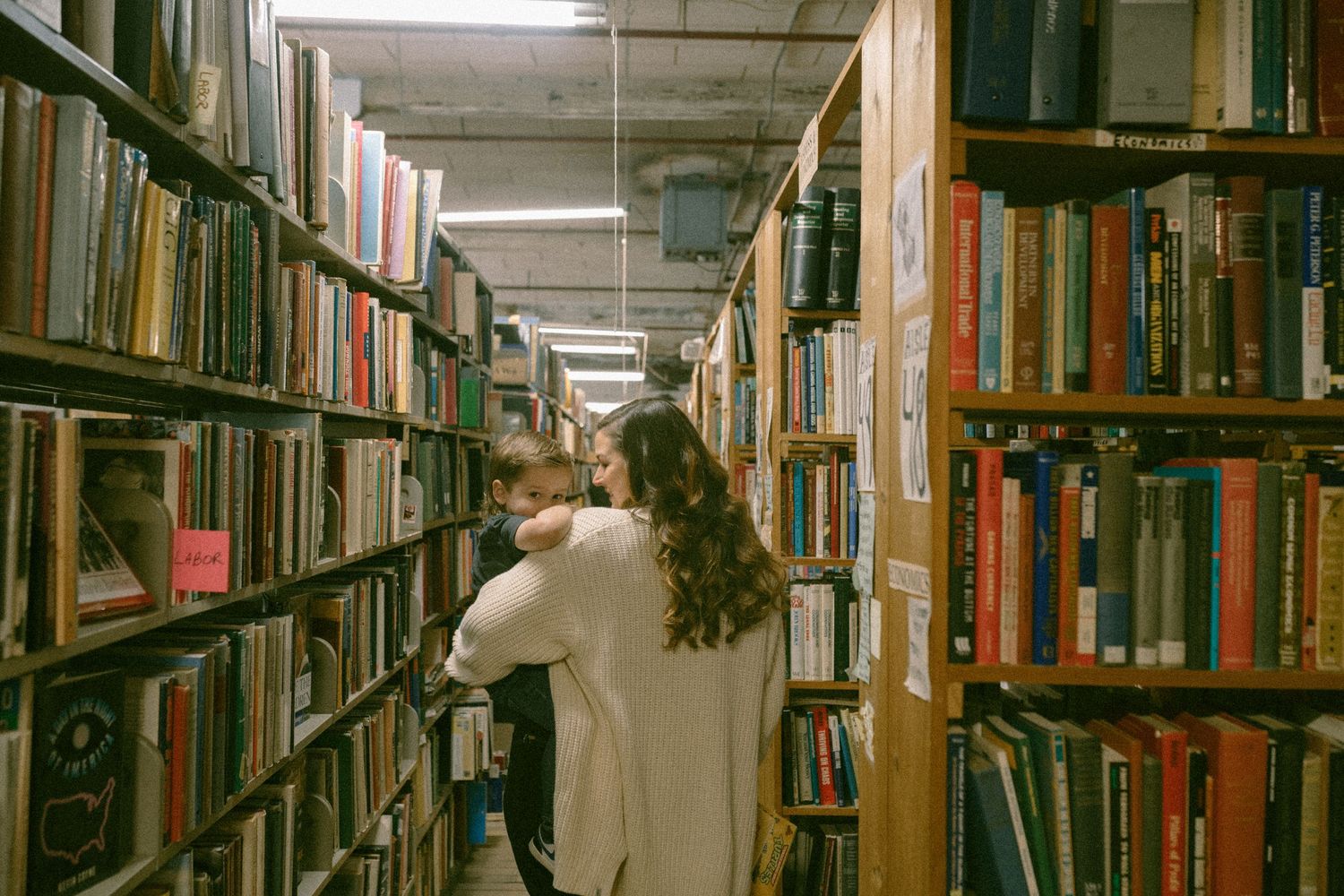 untraditional, unique family photos taken in a bookstore in downtown detroit