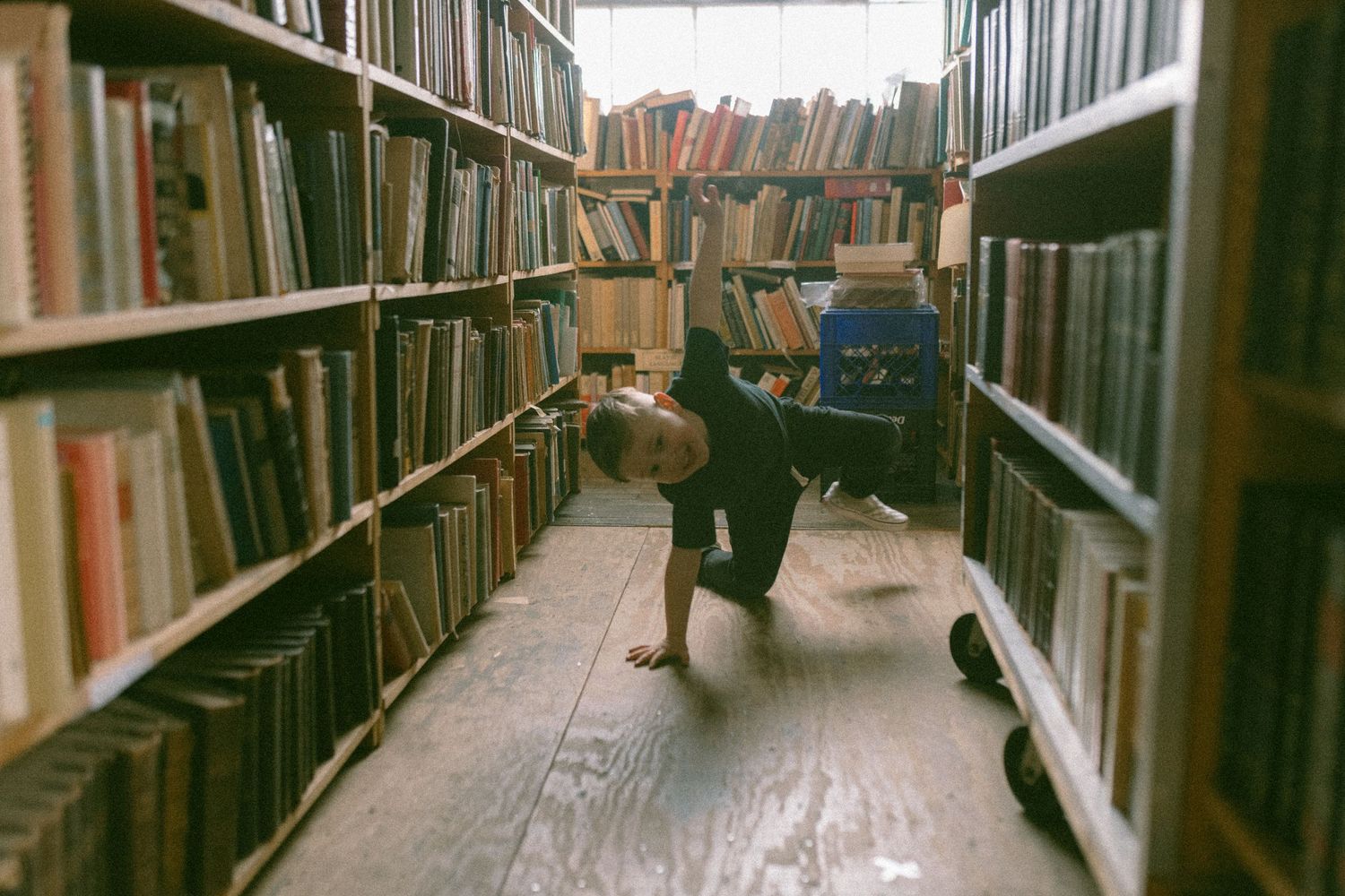 untraditional, unique family photos taken in a bookstore in downtown detroit